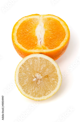 Halfes of orange and lemon isolated on white