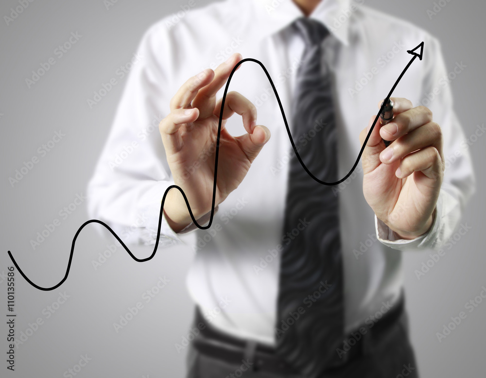 Businessman drawing graphics growing graph Businessman drawing graphics growing graph