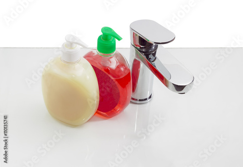 Single handle mixer and two bottles of liquid soap © An-T