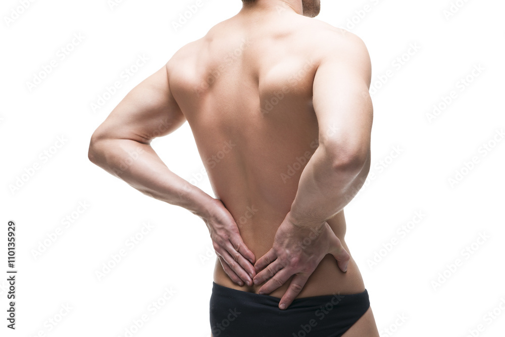 Man with backache. Pain in the human body. Muscular male body. Isolated on white background
