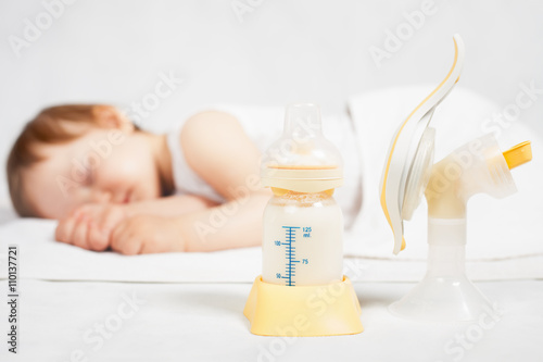 Manual breast pump, mothers breast milk photo