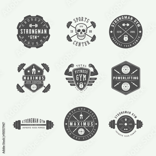 Set of gym logos, labels and slogans in vintage style.