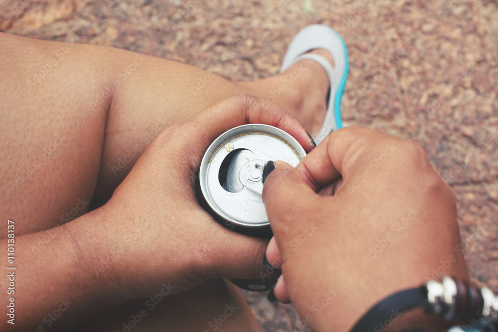 Fototapeta premium Woman drinking cola can