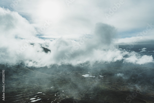 Airy landscape photo of clouds over mountains