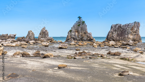 Hashigui-iwa Rock , a straight line of large and small unusually shaped rocks which stretches for around 850 meters at Kushimoto Town , Wakayama prefecture , Japan photo