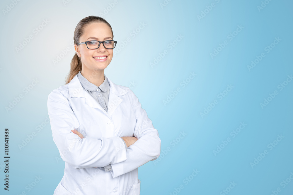 Smiling female doctor in uniform standing Smiling female doctor in uniform standing