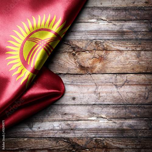 Flag of Kyrgyzstan on wooden boards