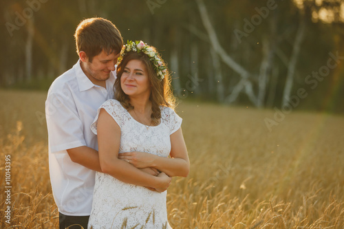 happy young couple in love romance fun wheat field summer