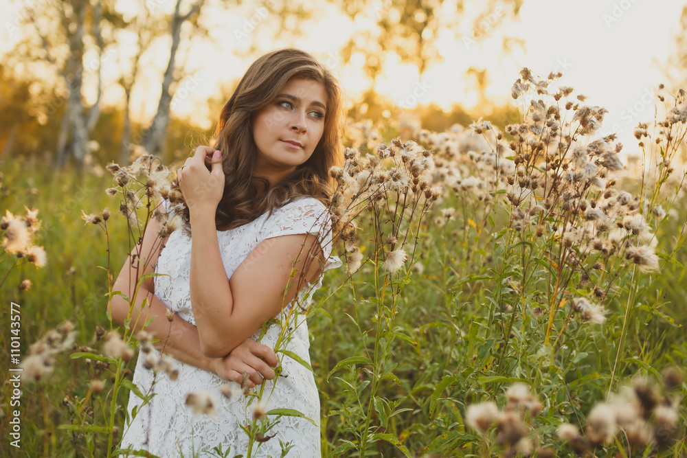 beautiful brown-haired girl in the Ukrainian high grass beautiful brown-haired girl in the Ukrainian high grass