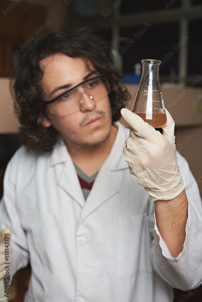 flask with chemistry in man hand