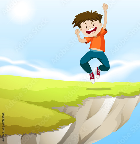 Boy jumping on the cliff