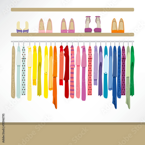 Fashion shop background with clothing on hangers, shirts, dresses and shoes