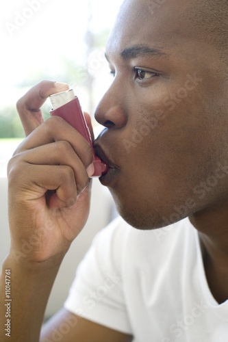 Asthma inhaler use photo