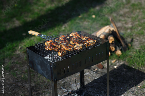 Delicious grilled meat over the coals on a barbecue