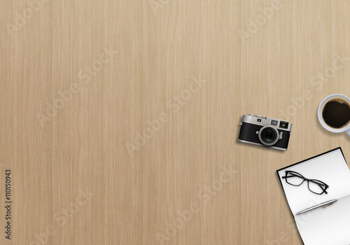 Office business top view image with book, pen, glasses, camera and coffee. Wooden background
