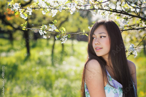 Beautiful chinese woman in spring meadow