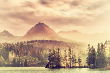 Vintage Sunset over a Lake in Mountains