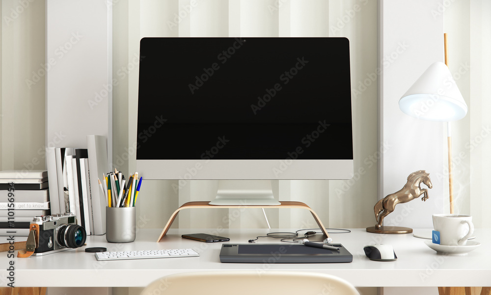 Creative desktop computer with drawing tablet on a desk in office Creative desktop computer with drawing tablet on a desk in office