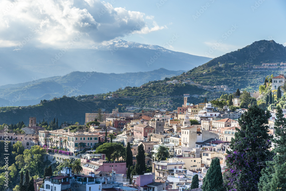 Panoramic view of the Taormina from the top. The town at the foot of Mount Etna in the sunlight. Sicily. Italy.