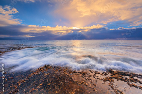 hawaiian sunset over the ocean coast. North shore of Oahu island.
