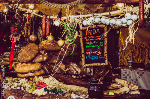 fair. food. food trade concept. old wooden hut in a vintage style background. bread on the ancient pillars. trade fair