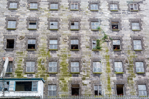 Canvas Print Abandoned building with many windows in decay, central parts of Dublin, Ireland
