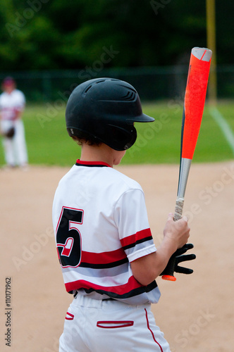 Close-up of american baseball boy from behind.