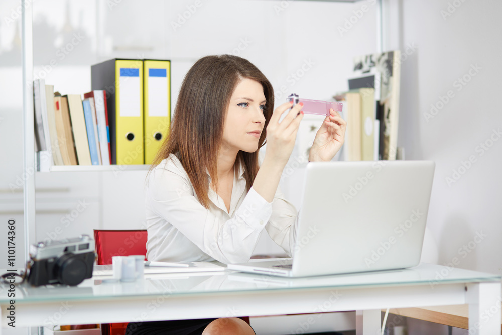 woman photographer working in studio