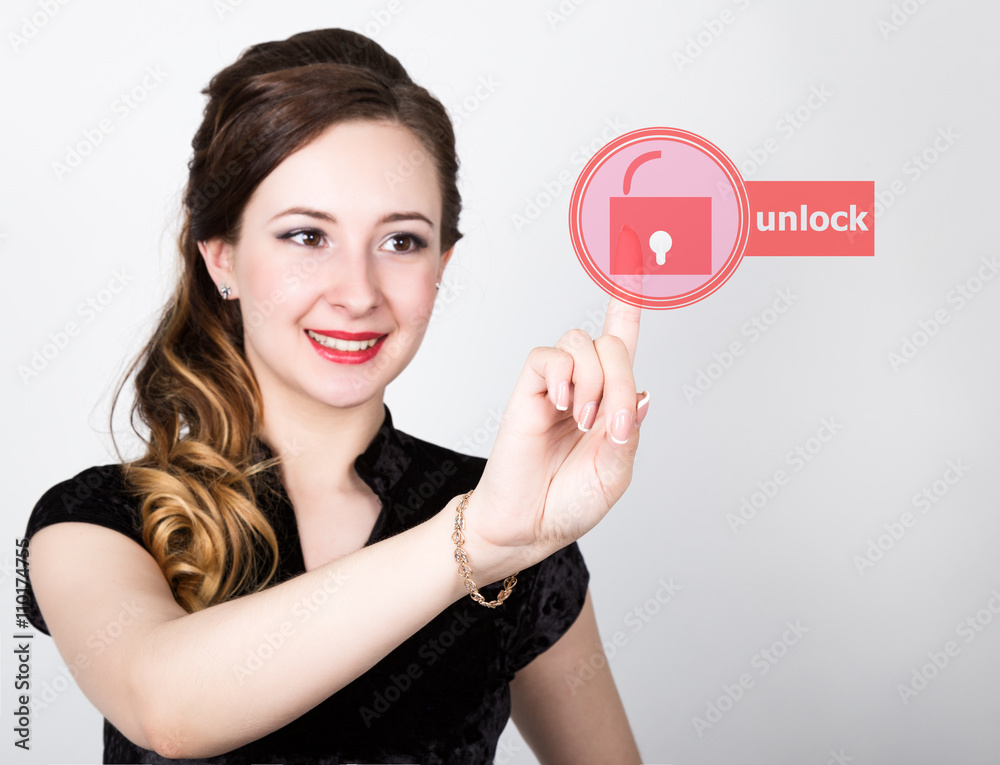 technology, internet and networking concept. beautiful woman in a black business shirt. woman presses unlock button on virtual screens technology, internet and networking concept. beautiful woman in a black business shirt. woman presses unlock button on virtual screens