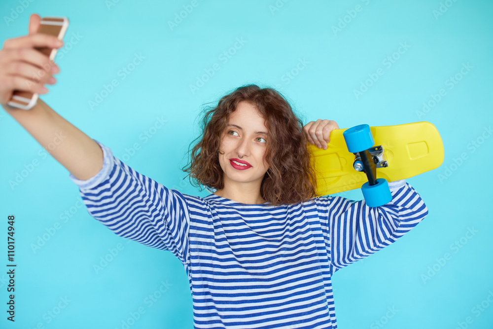Vivid portrait of hipster young woman with skateboard Vivid portrait of hipster young woman with skateboard