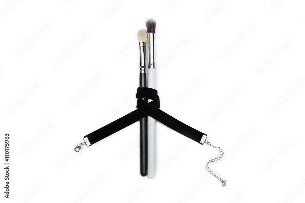 MakeUp brushes covered with black ribbon isolated MakeUp brushes covered with black ribbon isolated