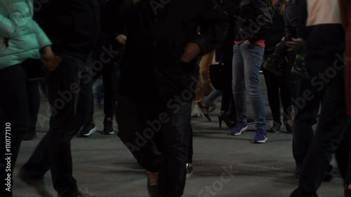 people walk the city at night