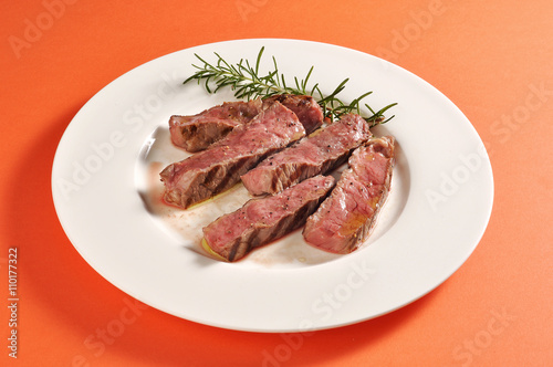 Plate with grilled steak portion