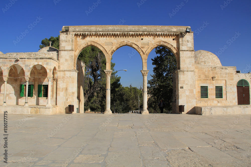 Arched colonnade and small building along the square on the Temple Mount in Jerusalem, Israel.