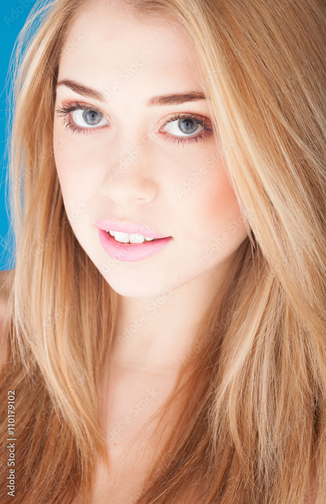Portrait of beautiful woman on blue background Portrait of beautiful woman on blue background
