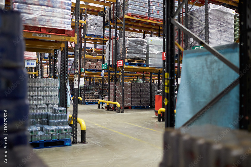 Aisles between storage racks in a distribution warehouse Aisles between storage racks in a distribution warehouse