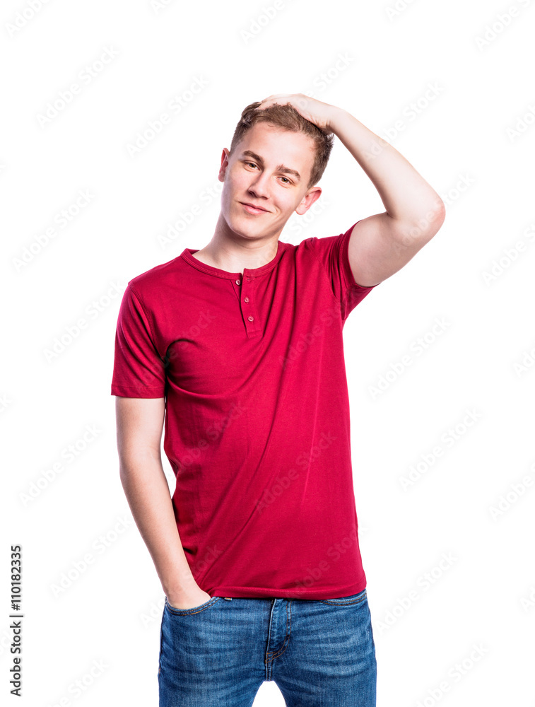 Boy in jeans and t-shirt, young man, studio shot Boy in jeans and t-shirt, young man, studio shot