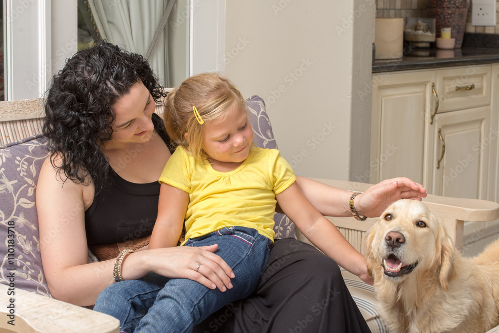 Mother and Daughter with Golden Retriever on Porch Mother and Daughter with Golden Retriever on Porch