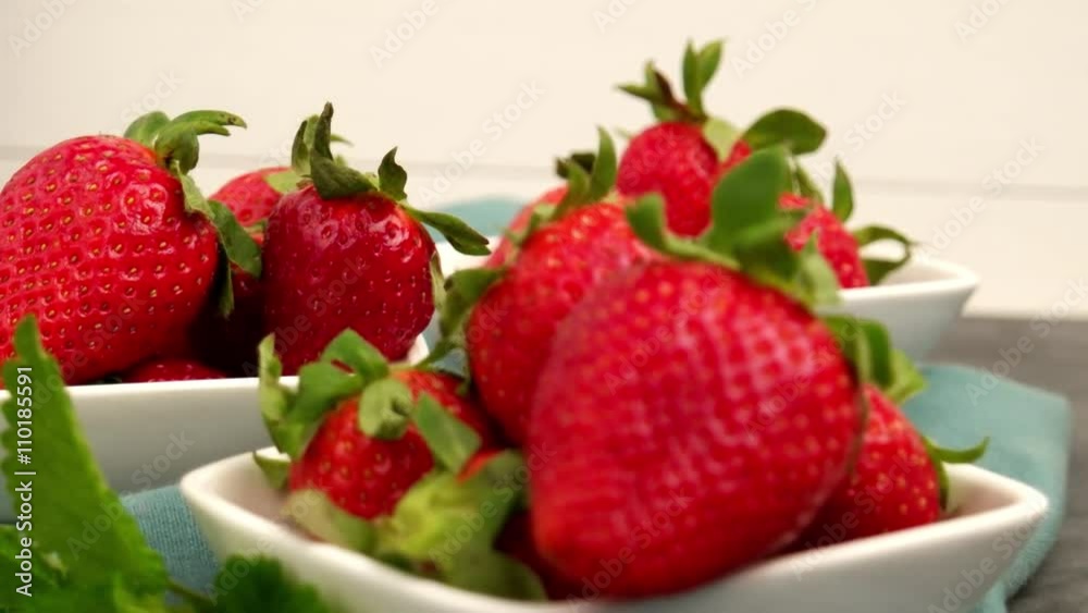 Appetizing strawberry in the bowl on a black slate table top. Appetizing strawberry in the bowl on a black slate table top.