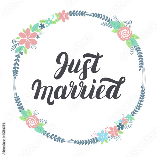 Just married lettering with floral wreath. 