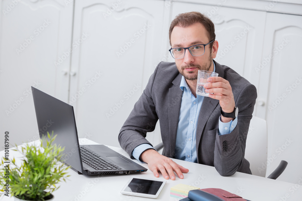 Businessman at the office desk Businessman at the office desk