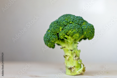 Fresh broccoli on a black slate, top view with space for text