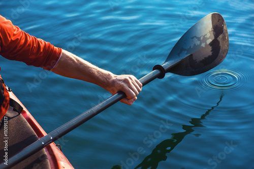 man's hand with a paddle kayak photo