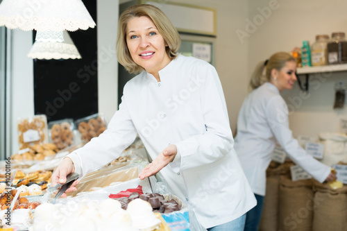 Woman offering tasty pastry