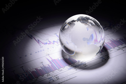 Bilde på lerret business concept of a glass globe on a trading chart