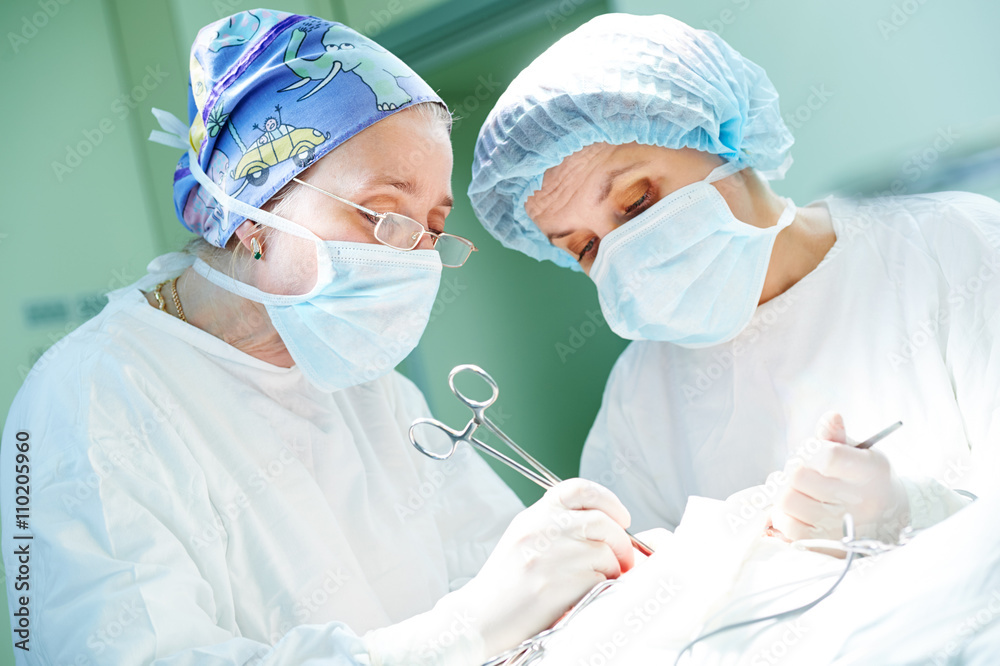 surgeons at work. female doctors operating in child surgery hospital