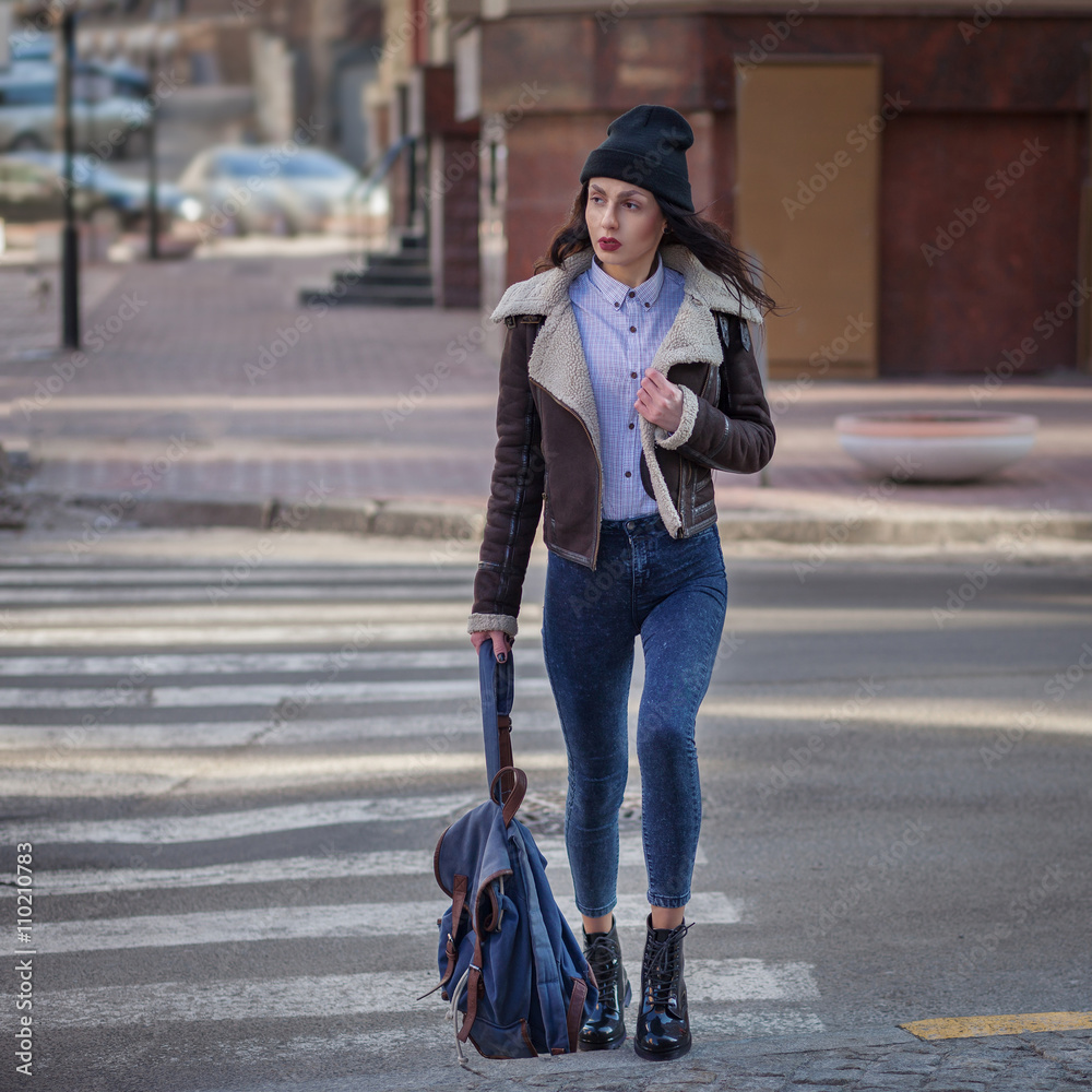 Outdoor lifestyle portrait of pretty young girl, wearing hipster swag grunge  style on urban background. Wearing hat and jeans with backpack. Spring  fashion woman. Toned style instagram filters. Stock Photo | Adobe