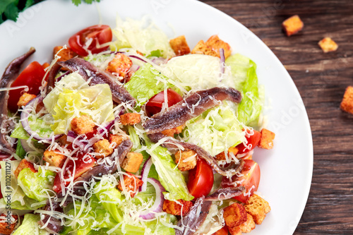 Fresh healthy Classic Caesar salad with anchovies.