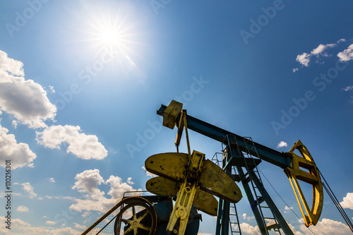 Wallpaper Mural Oil and gas pump on blue sky with cumulus clouds Torontodigital.ca