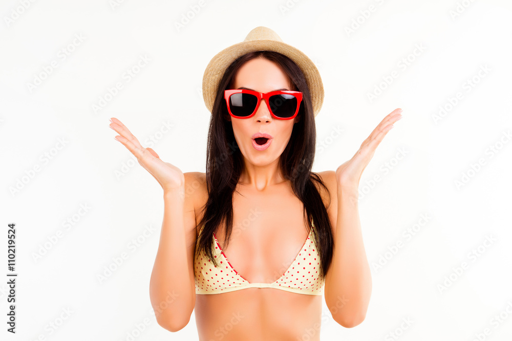 Wow! Pretty shocked woman in swimsuit, summer hat and glasses Wow! Pretty shocked woman in swimsuit, summer hat and glasses